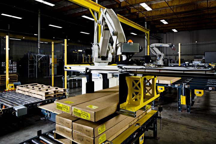 Columbia Okura Robot selecting lumber off a conveyor to palletize.