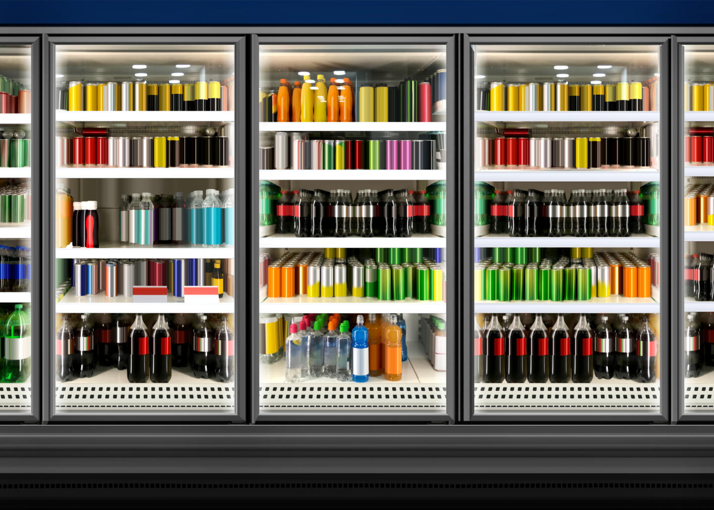 Juice cans and bottles in fridge at supermarket